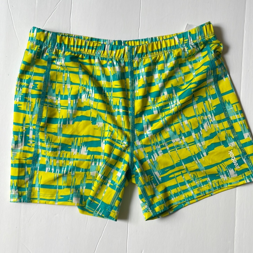 Run short. REEBOK///. FREE WITH BUNDLE